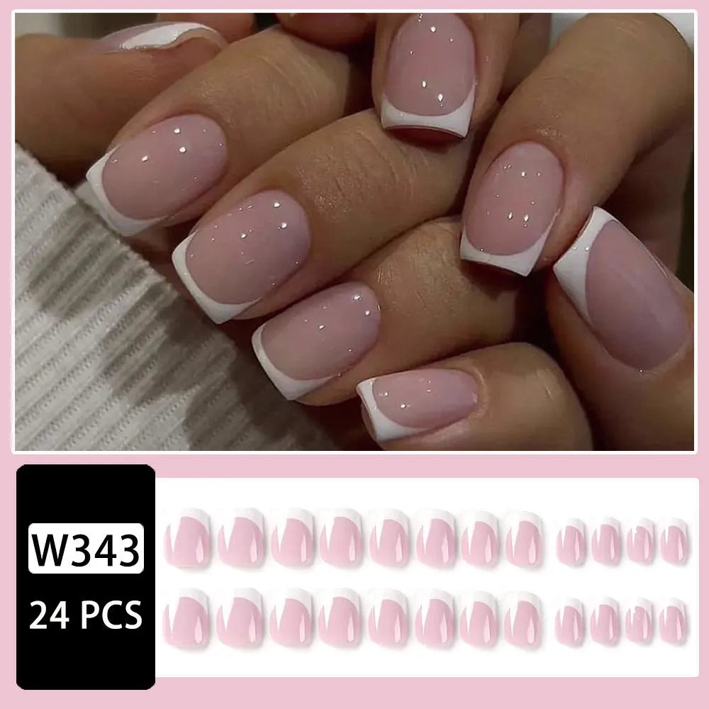 24 white fake nail plates with a black and white plaid pattern, shown in a nail tip style.