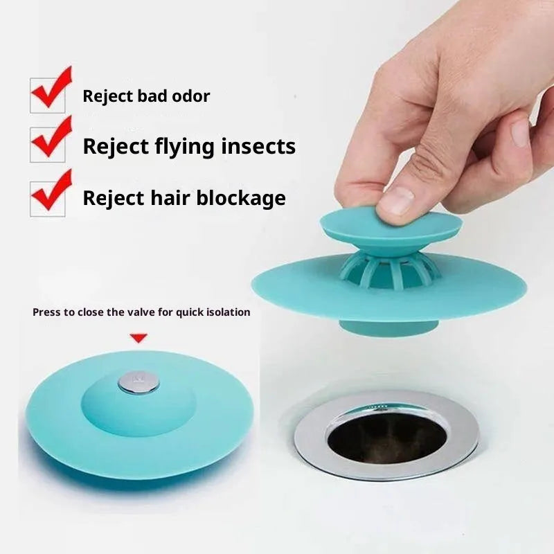 UFO-style silicone press sink drain cover in white on a modern kitchen sink