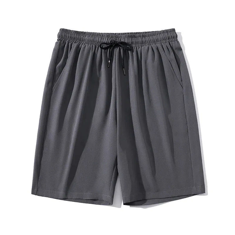 Men's grey ice silk cropped sports trousers with straight leg on a neutral background.