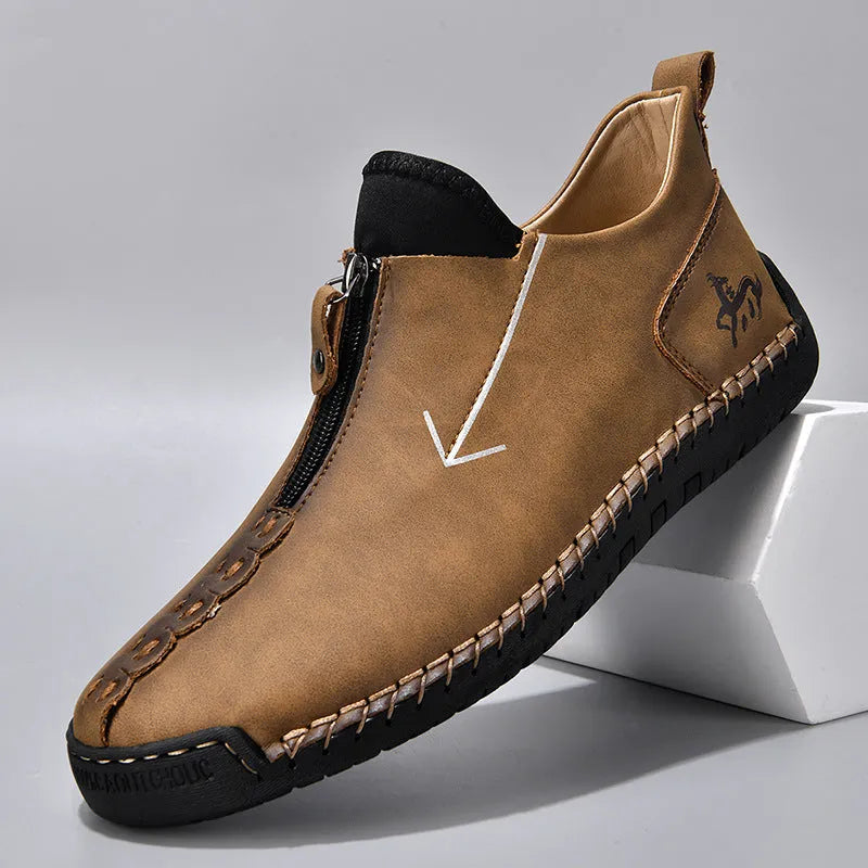 Men's brown leather martin boots with front zipper and hand-stitched detailing