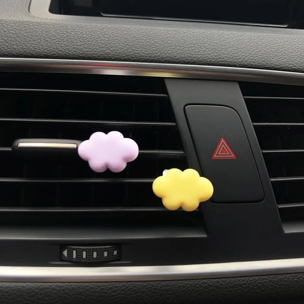 Resin car air vent fragrance clip in cartoon design, 17mm by 27mm, shown in one of six colours.