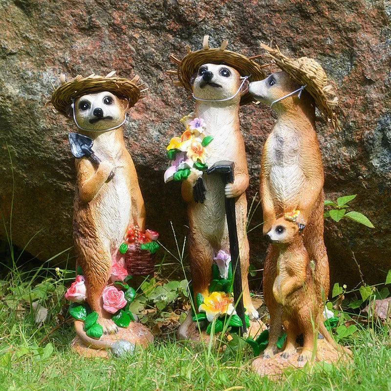 Resin mongoose garden ornament with straw hat and garden tool accessory