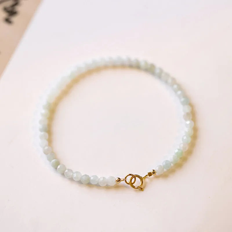 Women's Korean style retro jade bracelet in ball type design on a wrist.