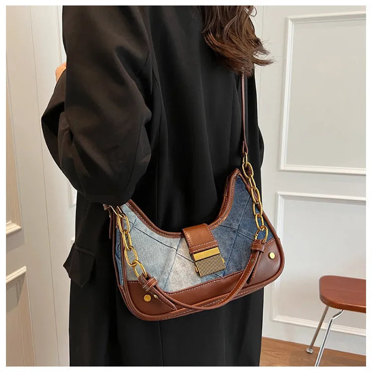Brown denim bucket shoulder bag with diamond mesh pattern and chain decorative elements
