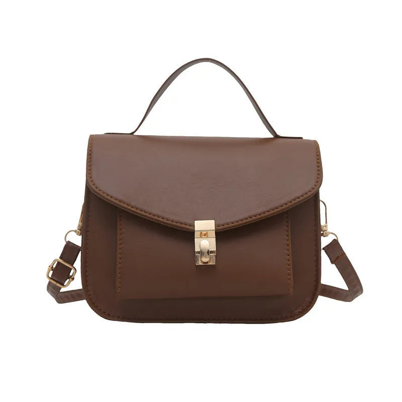 Retro style PU messenger bag in horizontal square format with sandwich pocket and crossbody strap