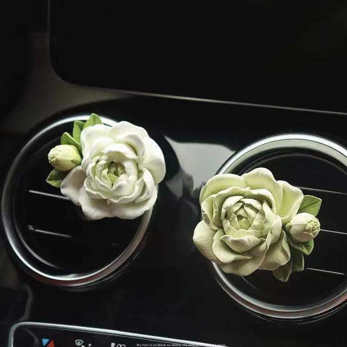 Solid jasmine car perfume for air vent with gypsum base and essential oil bottle in beige white or green.
