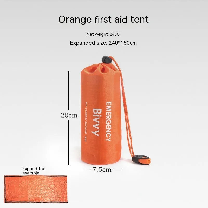 Orange emergency relief tent with sleeping bag and raincoat in temporary outdoor shelter setup