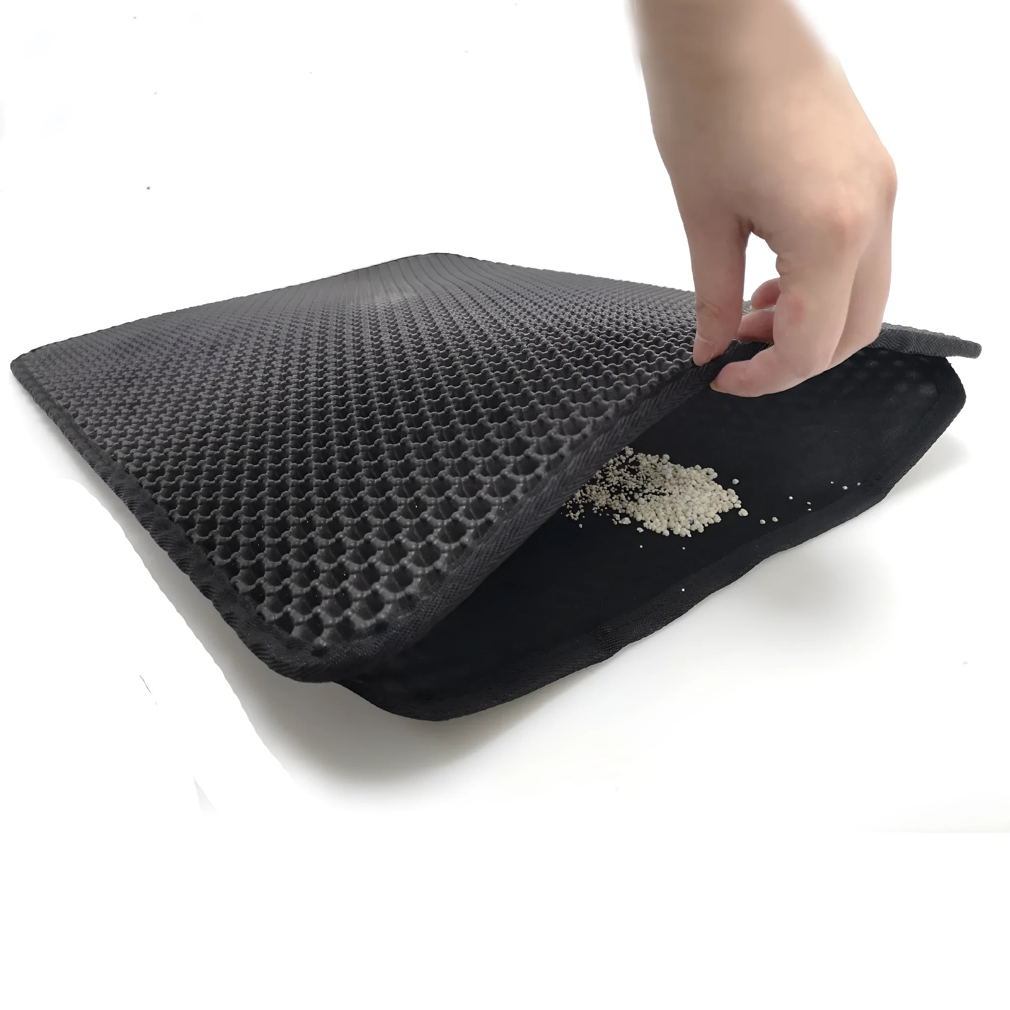 Double-layer EVA cat litter mat in black with honeycomb texture, 1.5cm thick, placed under a litter tray