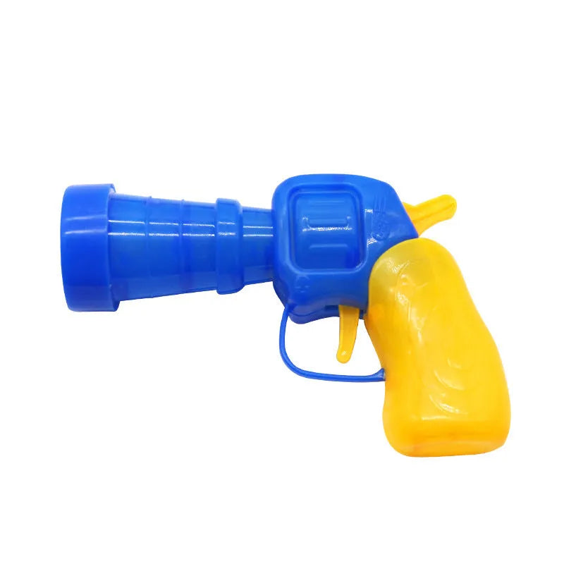 Pet toy launcher gun and soft plush balls for interactive play with cats and dogs.