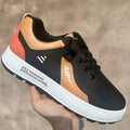 Men's white and black casual sports shoes with round toe, made from artificial PU.