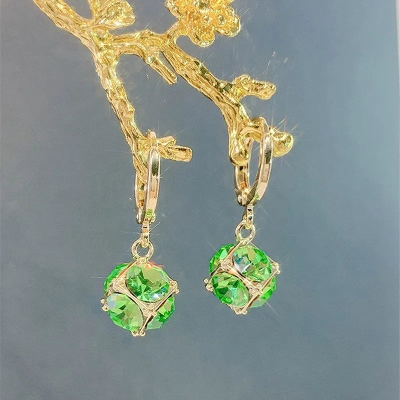 Women's geometric copper earrings with zircon and rose design elements in various colours