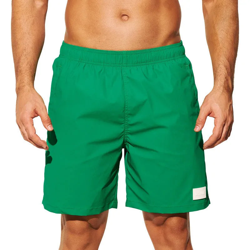 Men's solid colour quick-drying nylon sports shorts on a white background.