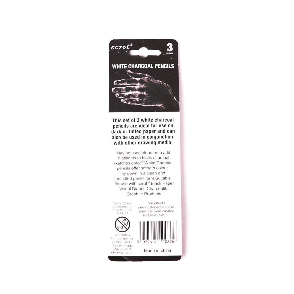 Three white charcoal sketching pencils with wooden barrels for highlighting artwork