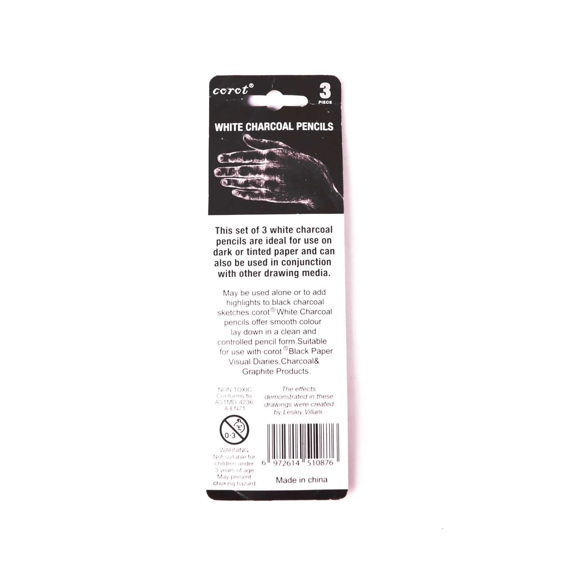 Three white charcoal sketching pencils with wooden barrels for highlighting artwork