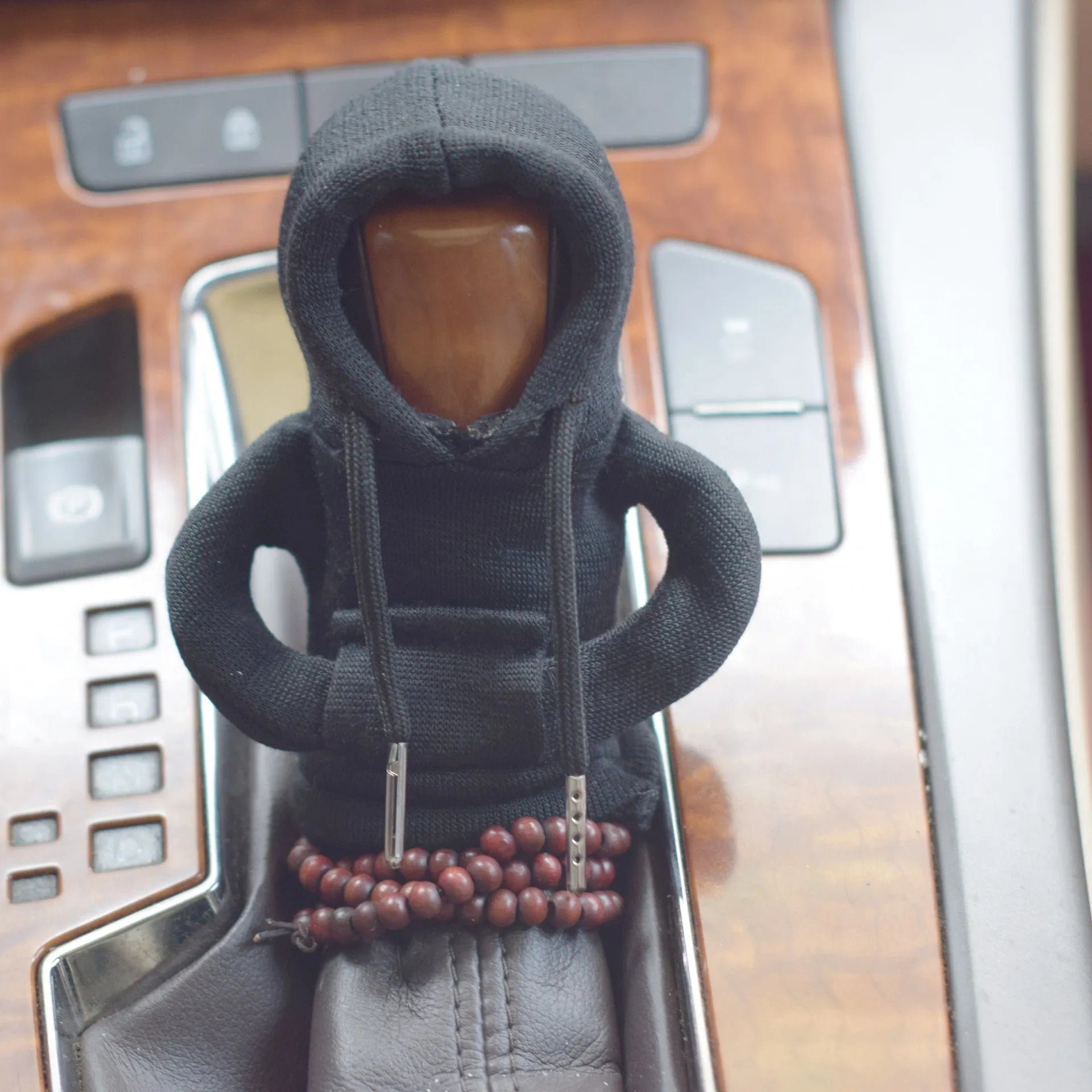 Dutch velvet car gear handle sleeve cover in multiple colours on a car gear lever.