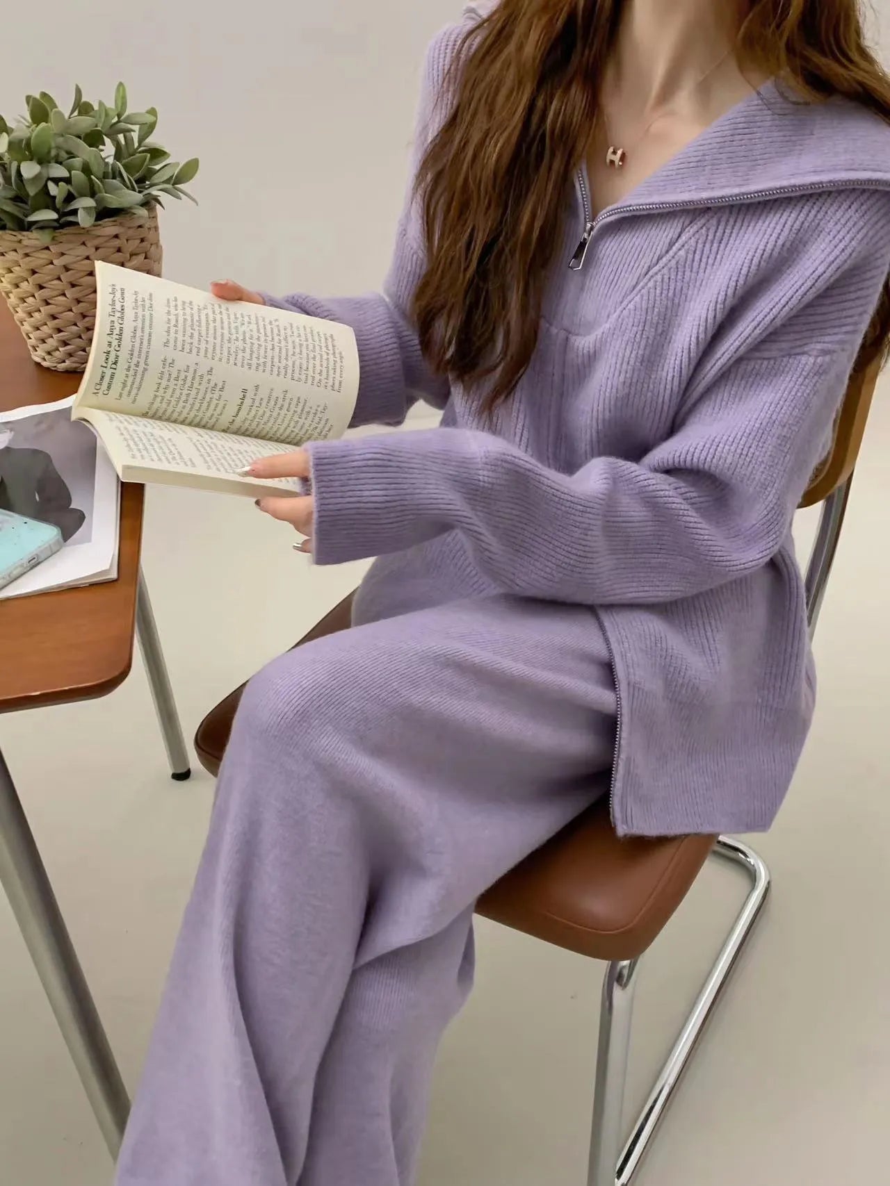 Women's knitted solid colour cardigan and wide leg pants two-piece set in beige.