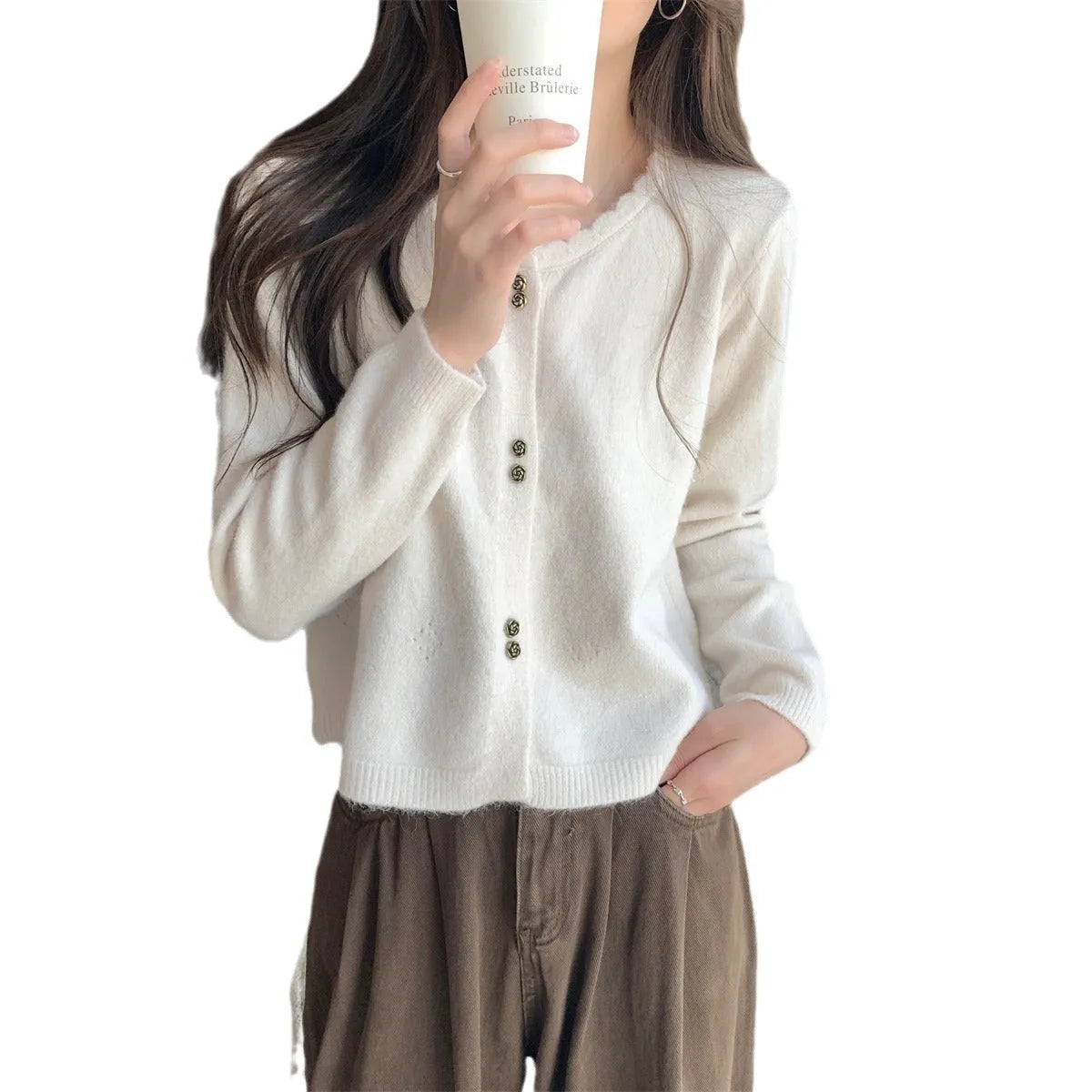 Women's milky white acrylic long-sleeve cardigan coat worn open, free size regular fit.