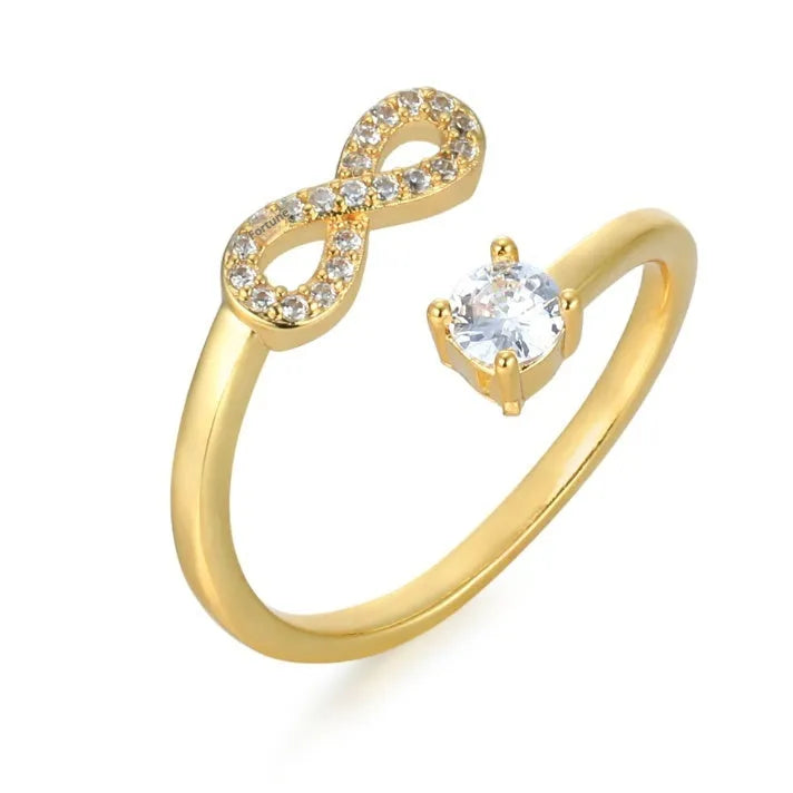 Geometric open zircon letter ring showing metal construction with inlaid gems in gold rose gold or silver finish