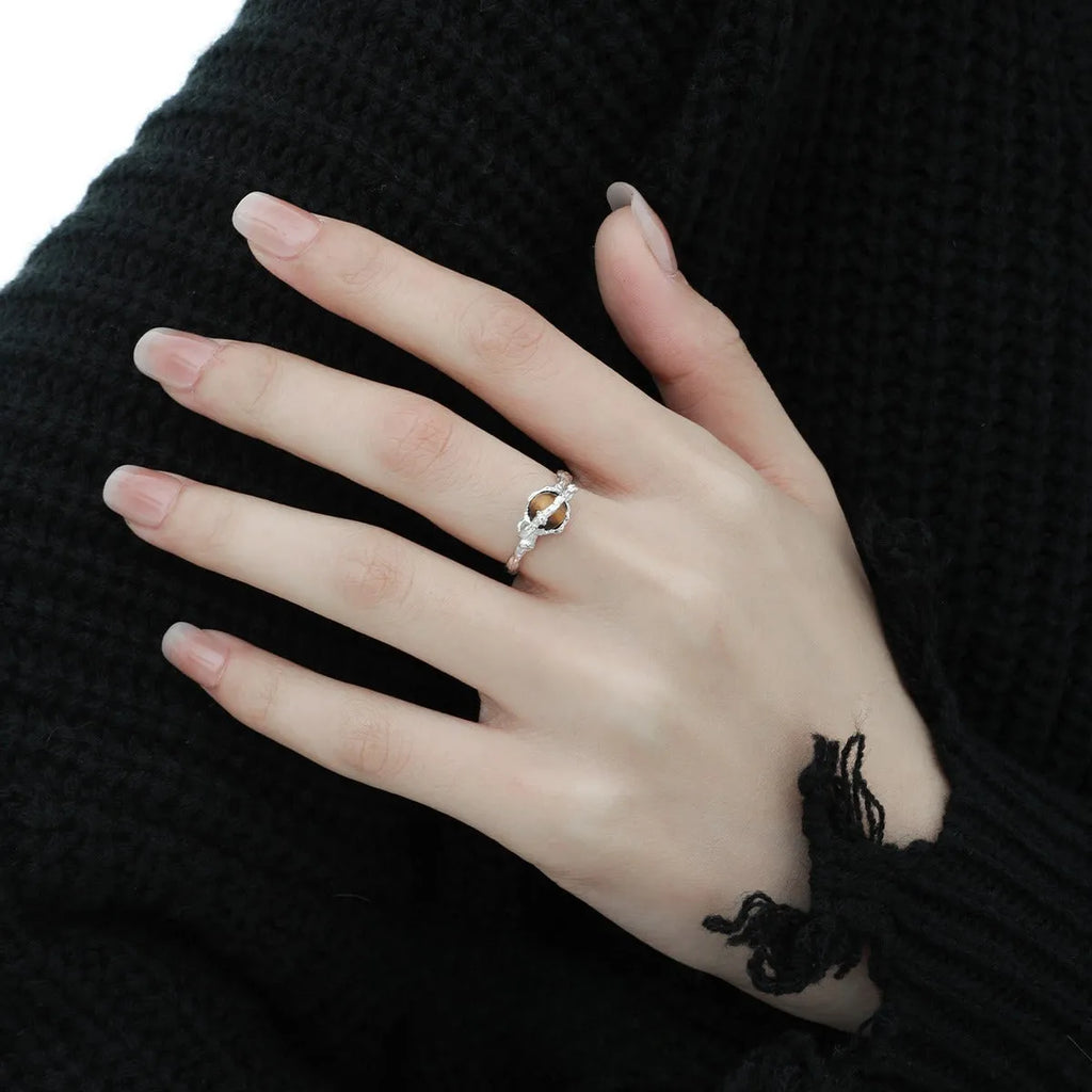 Adjustable opening Saturn ring in white gold colour tone on silver material