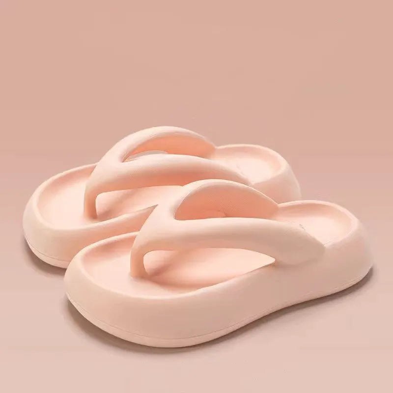 A pair of EVA thick-soled flip-flops with a bow detail on the upper, shown in one of the available colours.