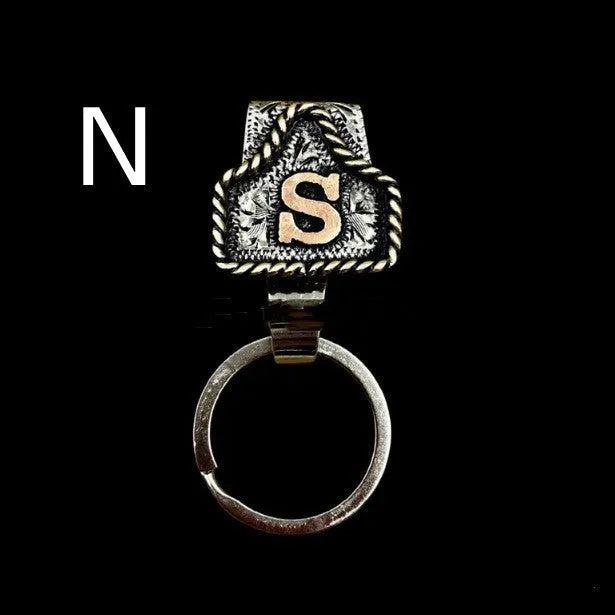 Handmade stainless steel cow tag belt key holder with engraved number plate on a split ring.