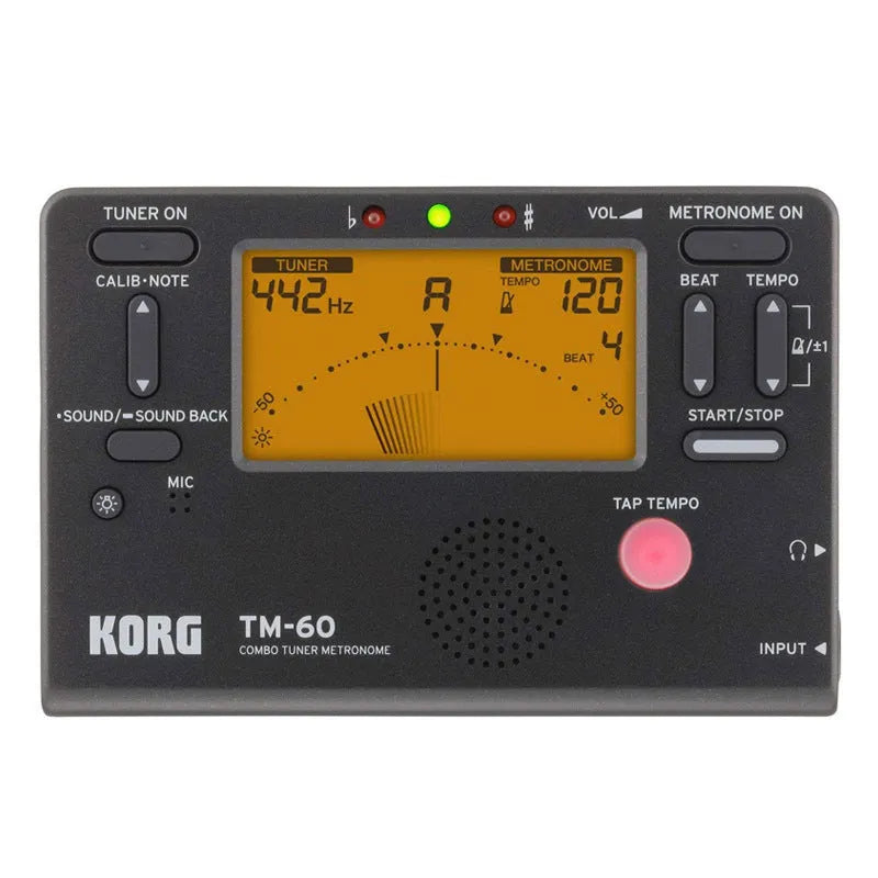 TM-60 black and white universal electronic metronome and tuner on a table.