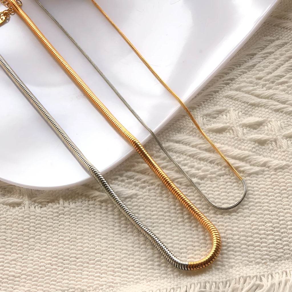 Golden stainless steel snake bone chain necklace with 3mm thickness and geometric line design