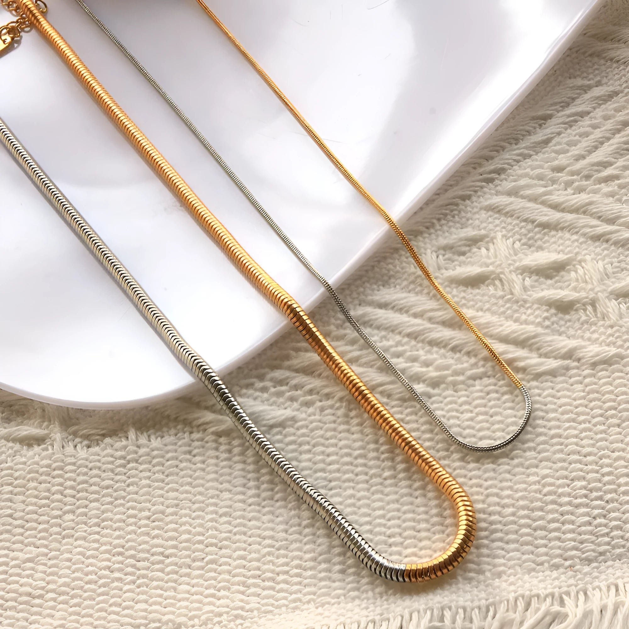 Golden stainless steel snake bone chain necklace with 3mm thickness and geometric line design