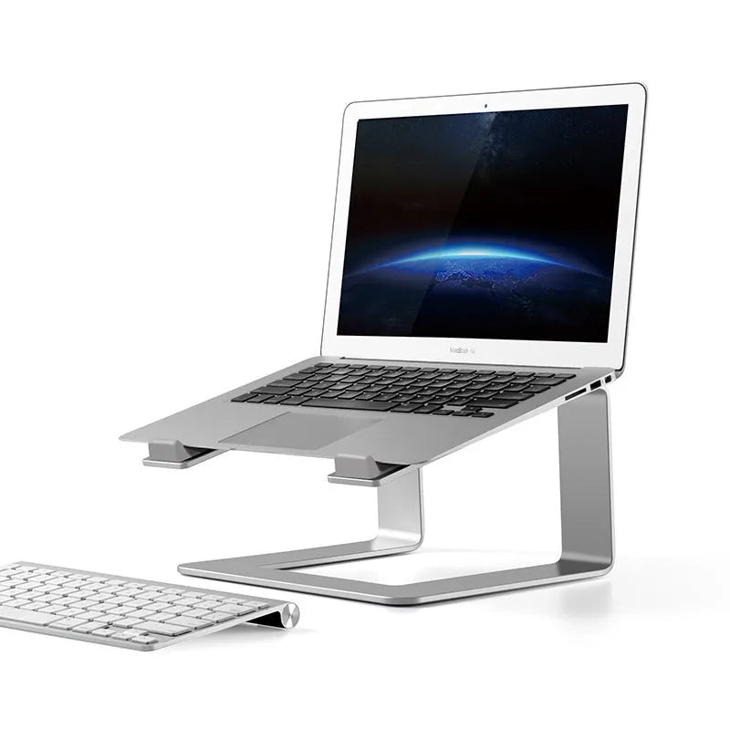Aluminium alloy laptop stand in black or silver measuring 29.9 x 25.8 x 18.5 cm on a desk