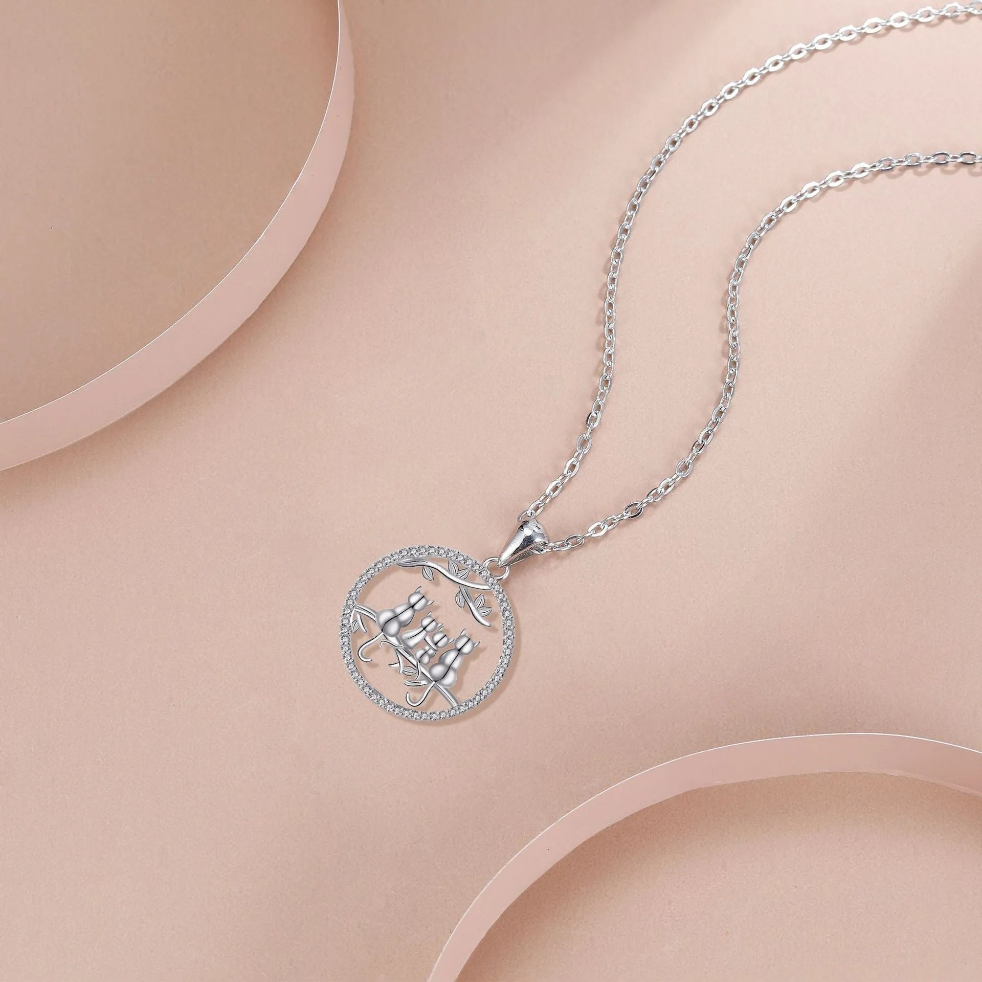 Women's silver-toned necklace with four kitten charms on cross chain