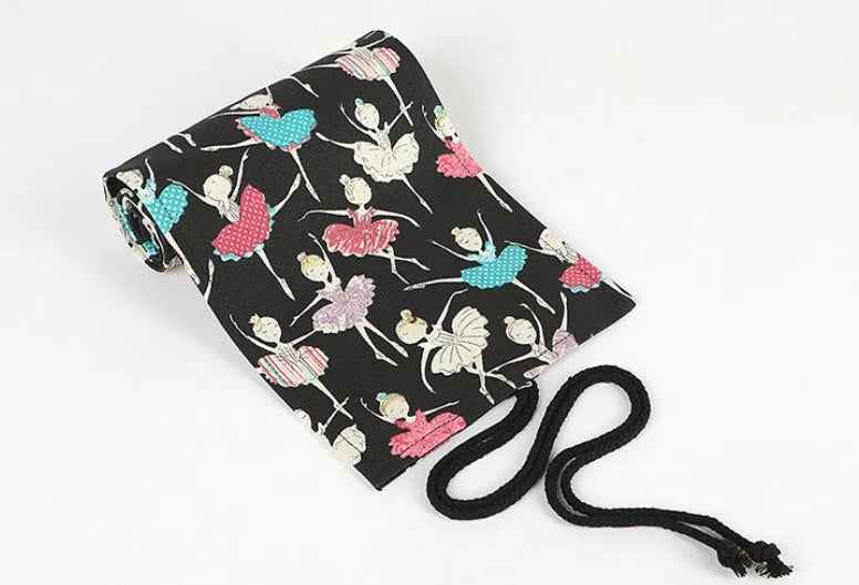 Square canvas pencil case with ballet girl print, shown open to display rolling storage for multiple pencils.