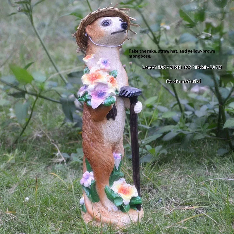 Resin mongoose garden ornament with straw hat and garden tool accessory