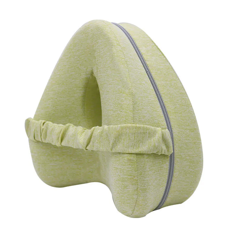Heart-shaped dark blue memory foam leg pillow for adult knee or ankle support.