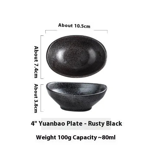 Oval Japanese ceramic sauce dipping bowl with underglaze finish on a table.