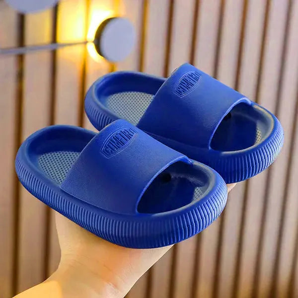 Mixed colour children's EVA slippers with non-slip soles in sizes for ages 24-35.