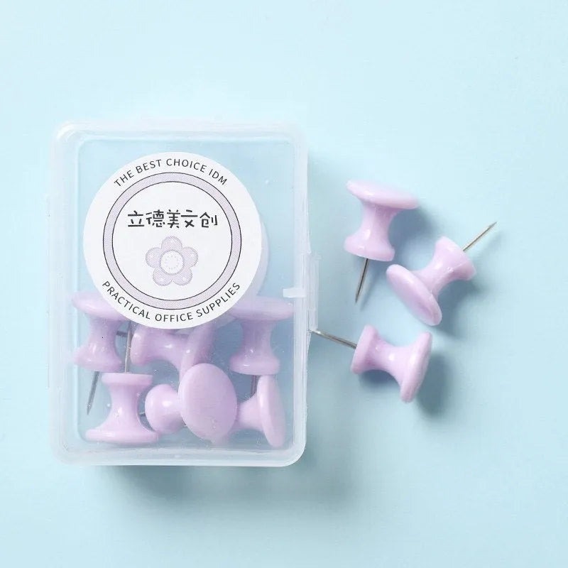 Plastic push pins in cherry blossom pink, mint green, and lavender, showing large and small sizes in a box.