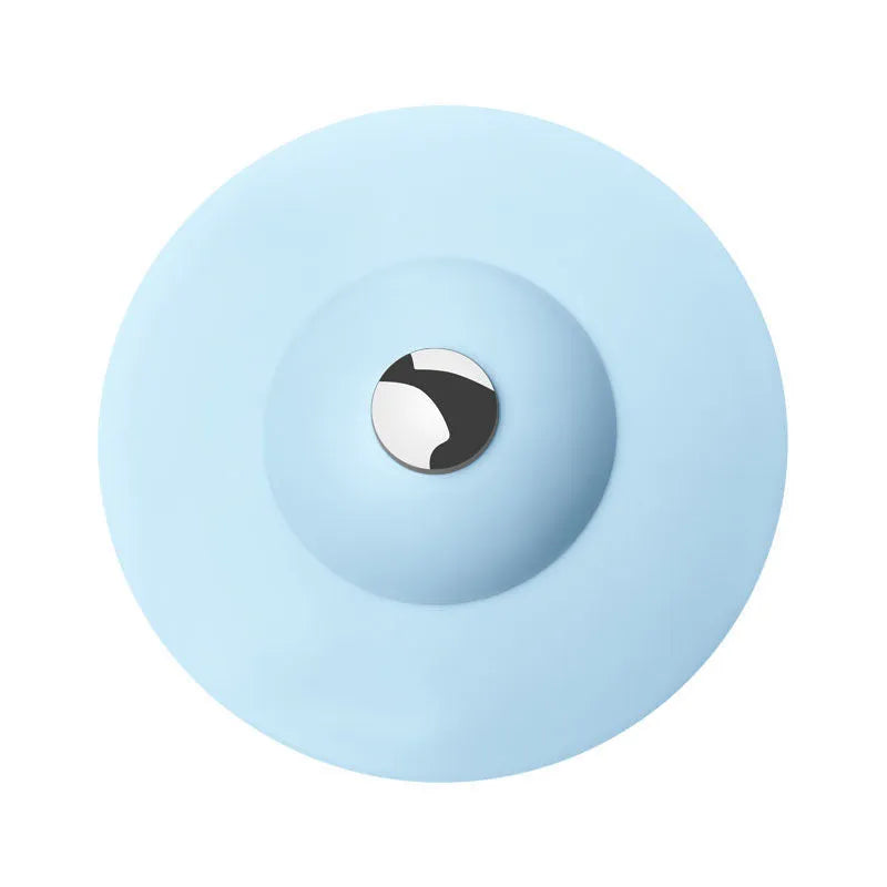 UFO-style silicone press sink drain cover in white on a modern kitchen sink