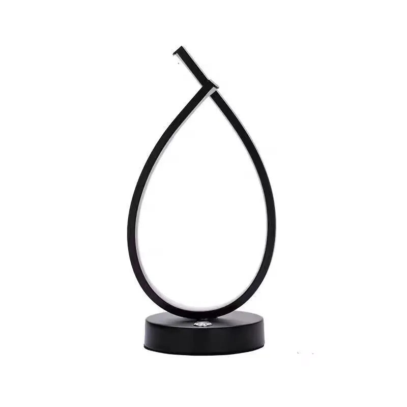 Water drop-shaped black bedside table lamp with USB charging cable
