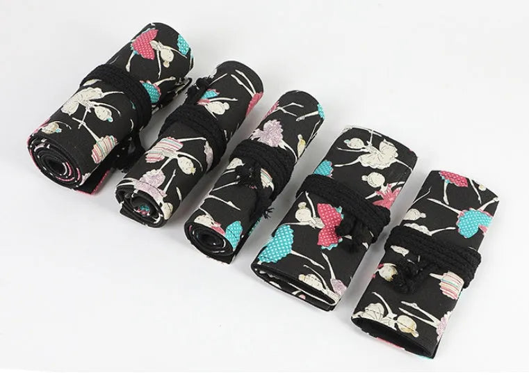 Square canvas pencil case with ballet girl print, shown open to display rolling storage for multiple pencils.