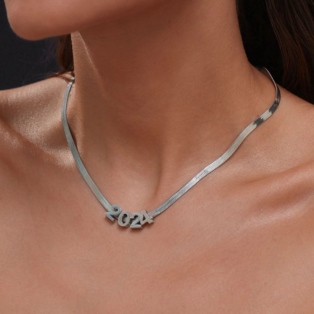 Titanium steel personalised necklace showing letter pendant on 40.5cm chain with electroplated gold finish