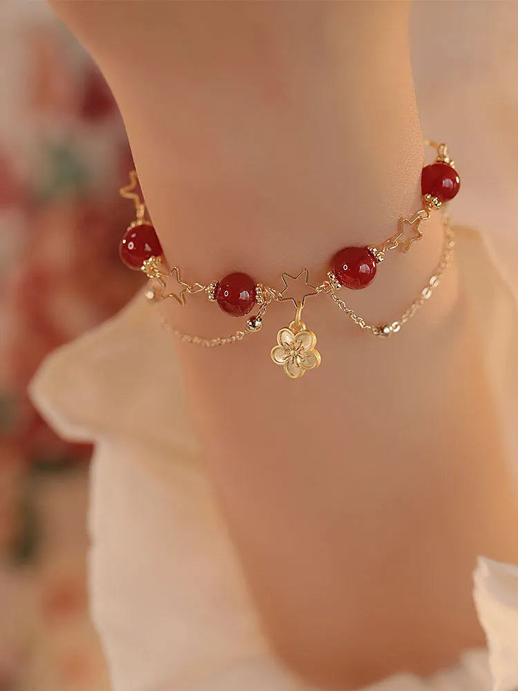 Red agate double layer bracelet with peach blossom charm and manual craftsmanship details