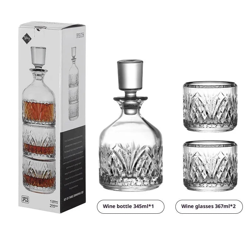 Stackable engraved glass wine glasses and sake barrel on a table