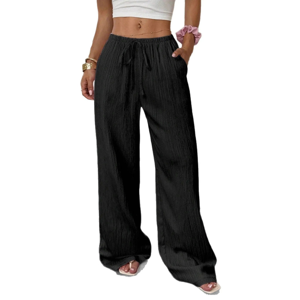 Women's black wide-leg trousers with lace-up waist detailing and adjustable ties