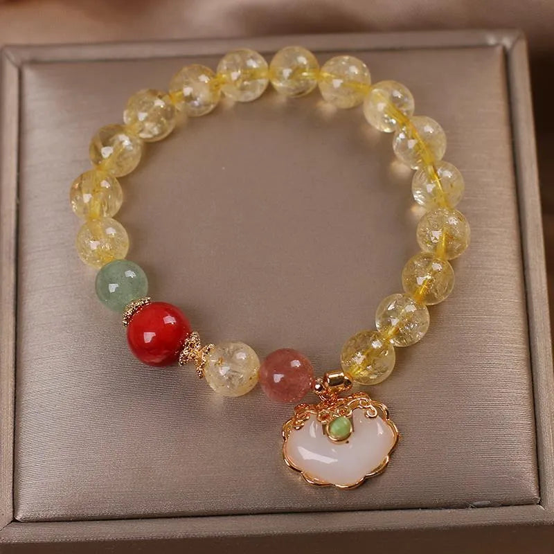 Women's alloy bracelet with a yellow citrine jade ruyi pendant in an original design.