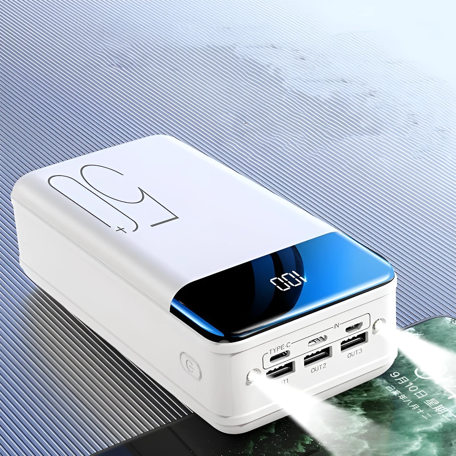 Large 50000mAh capacity power bank with three output ports in black or white plastic casing