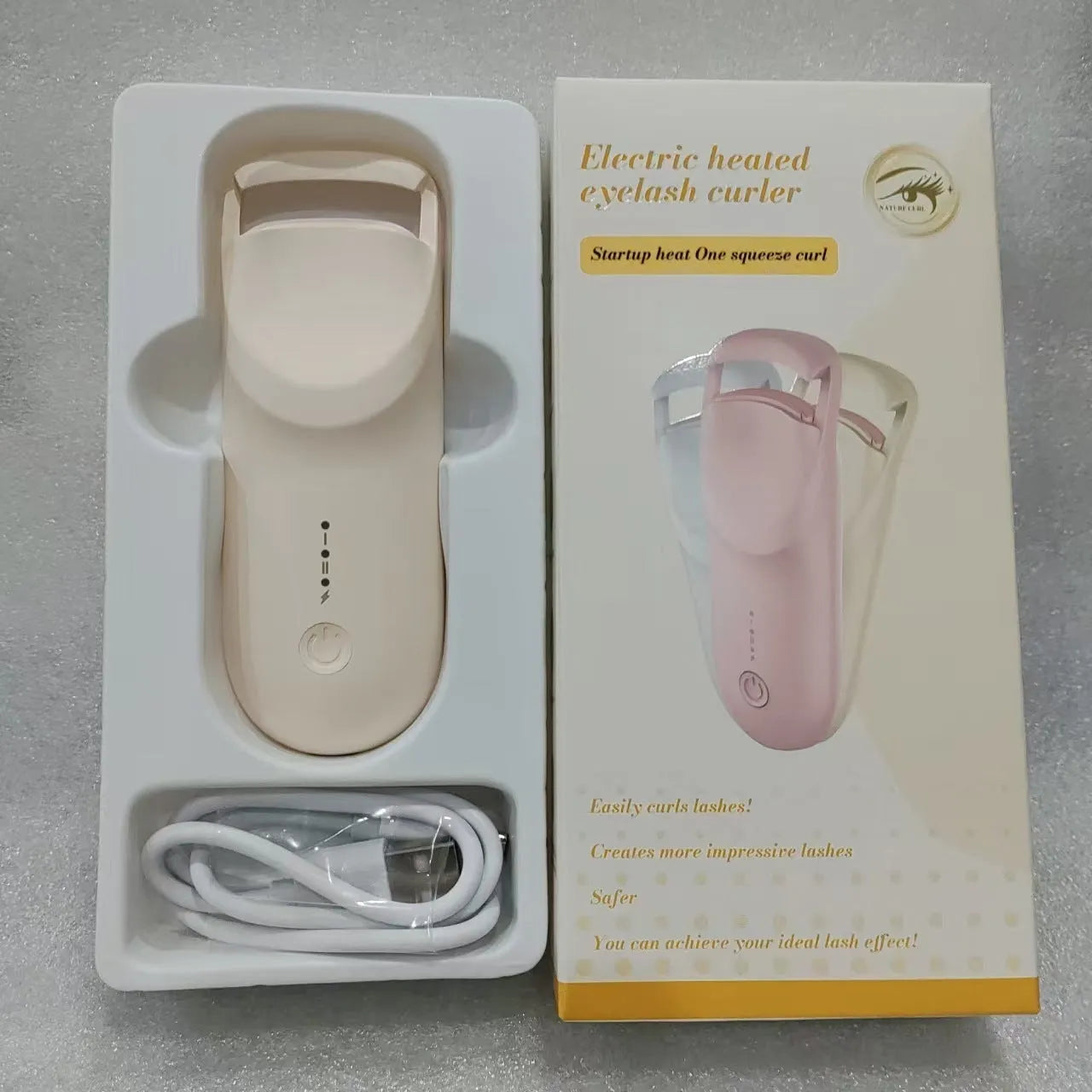 USB-C rechargeable electric eyelash curler in cream white, pink, or apricot with charging cable