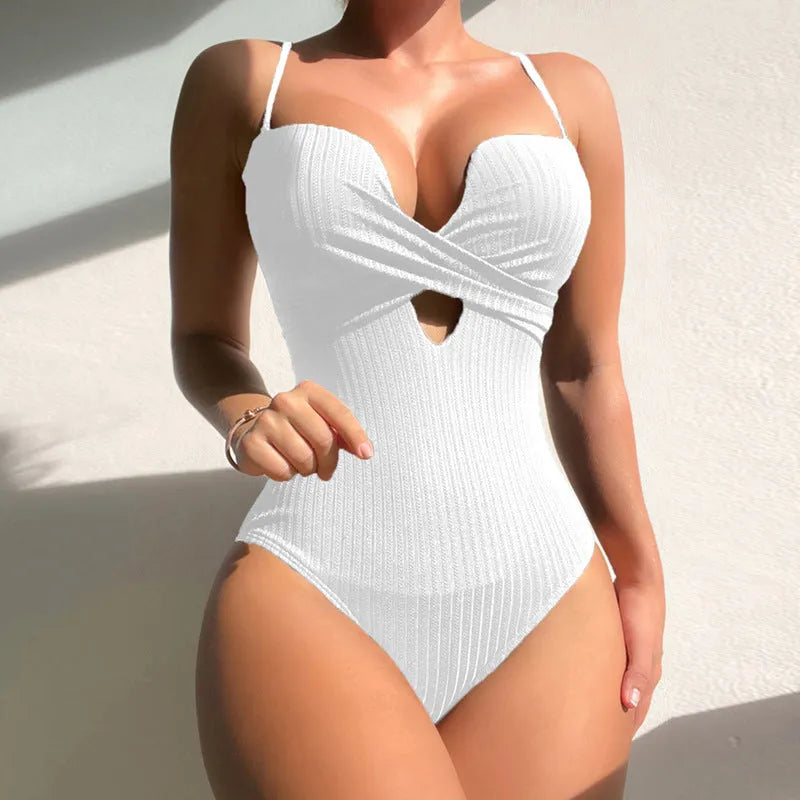 Women's solid colour one-piece swimsuit in slim fit shown in white, burgundy, and rose red.