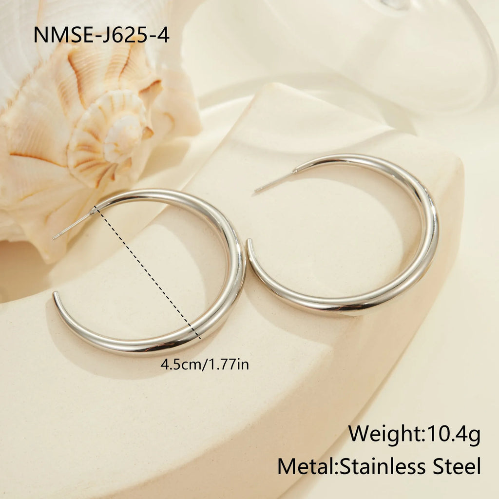 Women's stainless steel hoop earrings with 18K PVD gold plating in geometric round design