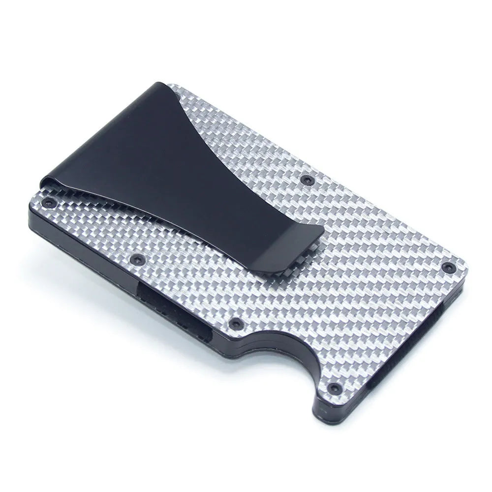 Geometric aluminium and carbon fibre card wallet for business cards and banknotes in a gift box.