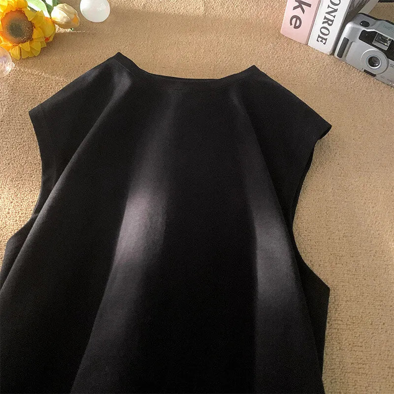 Men's loose solid colour sleeveless cotton tank top on a hanger, shown in a light apricot shade.